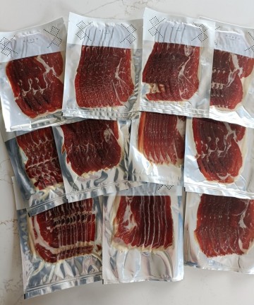 Tranches de jambon Bellota ibérique 100% puroAffinées en Extremadura, en sachets individuels.